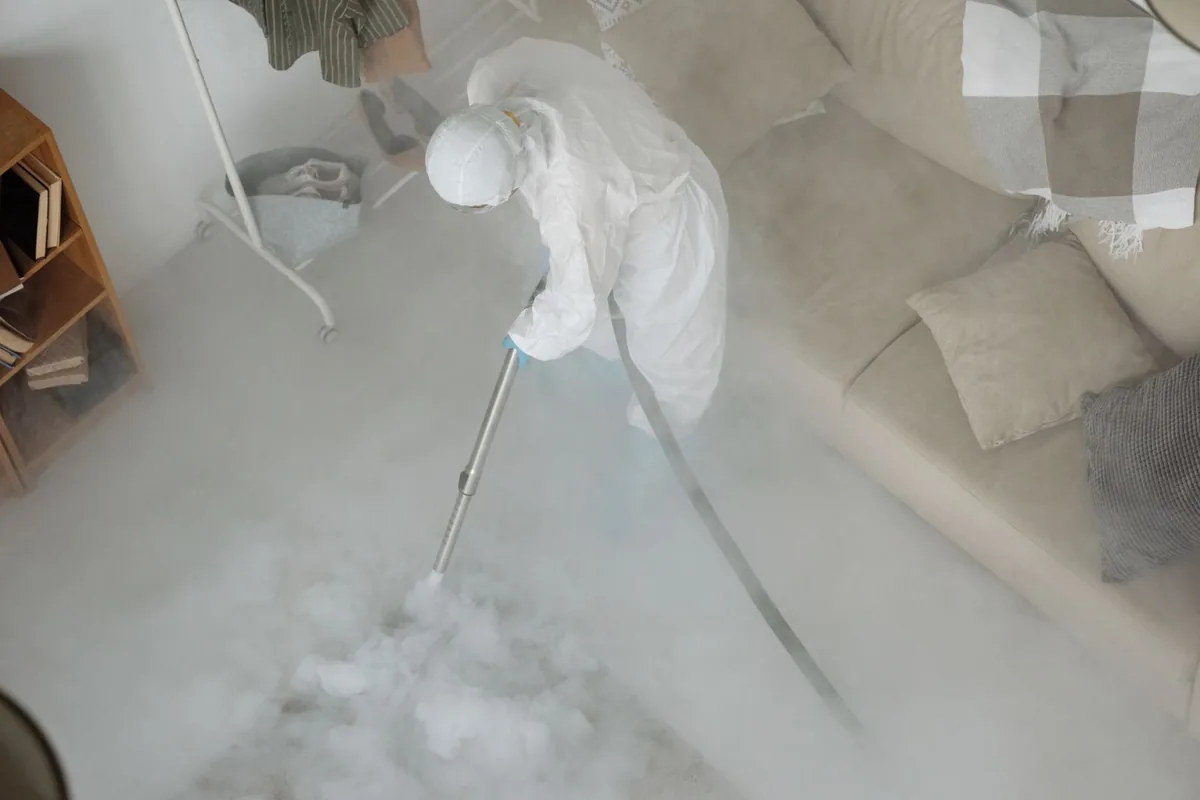 Biohazard cleanup technician in protective equipment, Marble Hill, MO